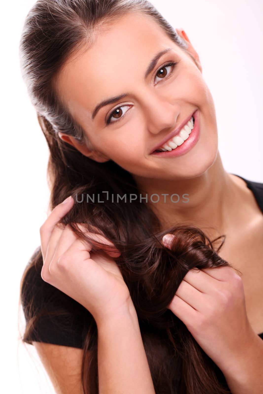 Portrait of Attractive smiling woman touching her hair