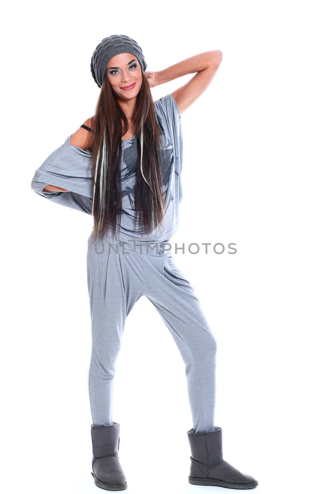 Cute and modern woman in hat over a white background