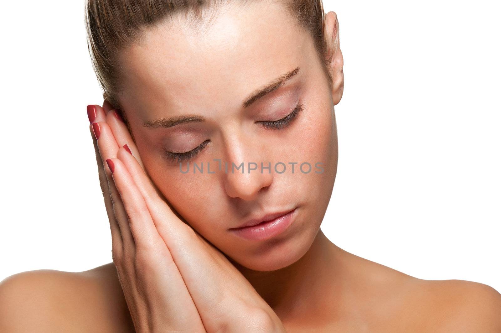 Woman with her face resting on her hands, sleeping, isolated in white