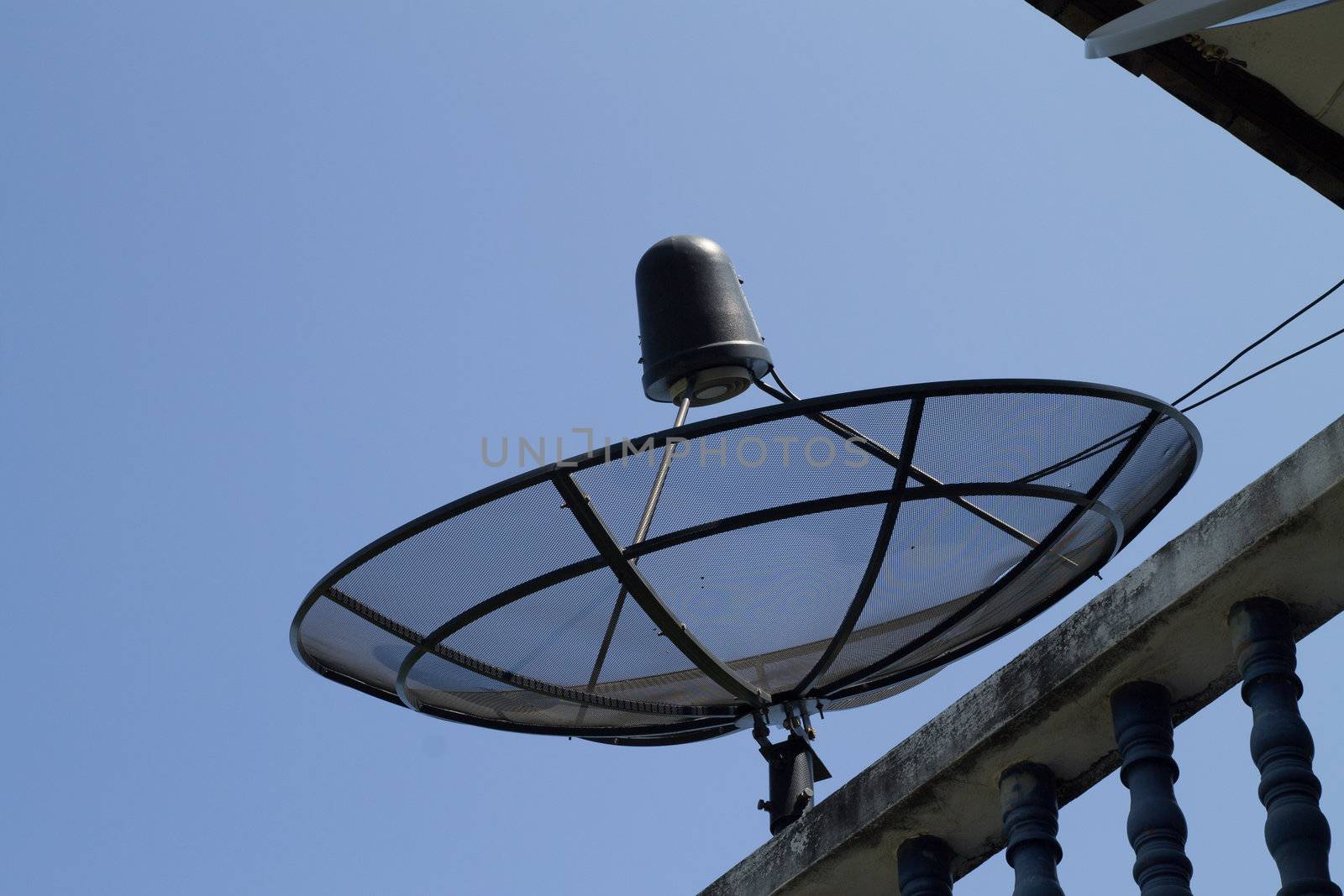 the satelite dish of cable tv for home use on the roof of building