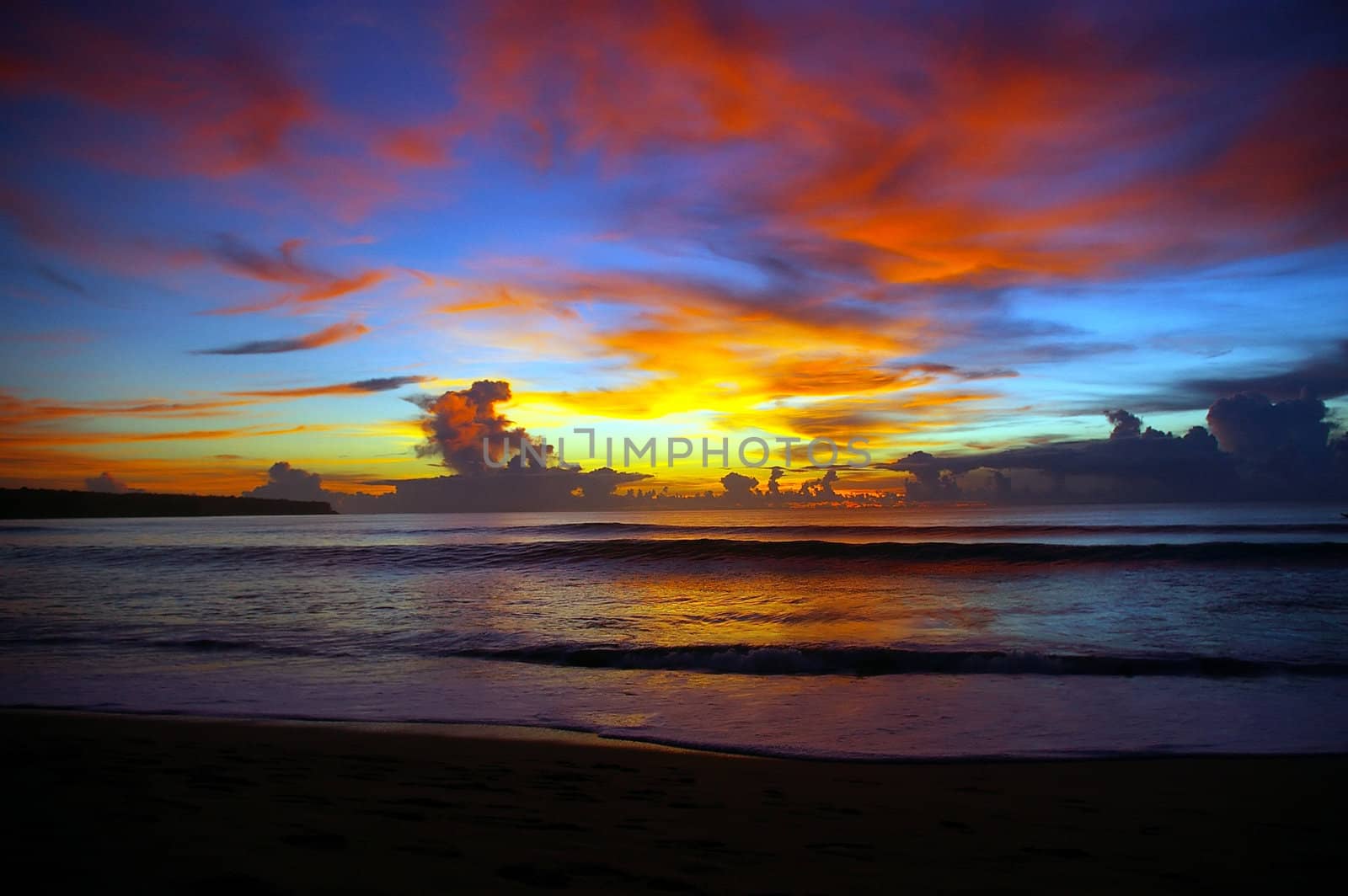 Sunset over Indian ocean, Dreamland beach, Bali, Indonesia.