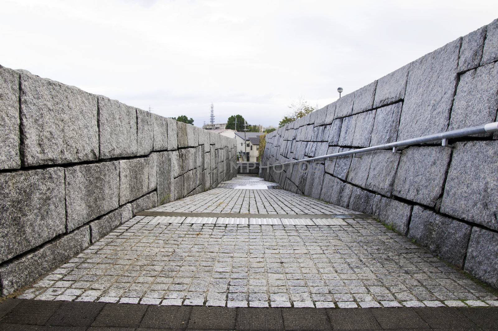 wall of rough granite blocks  by siraanamwong