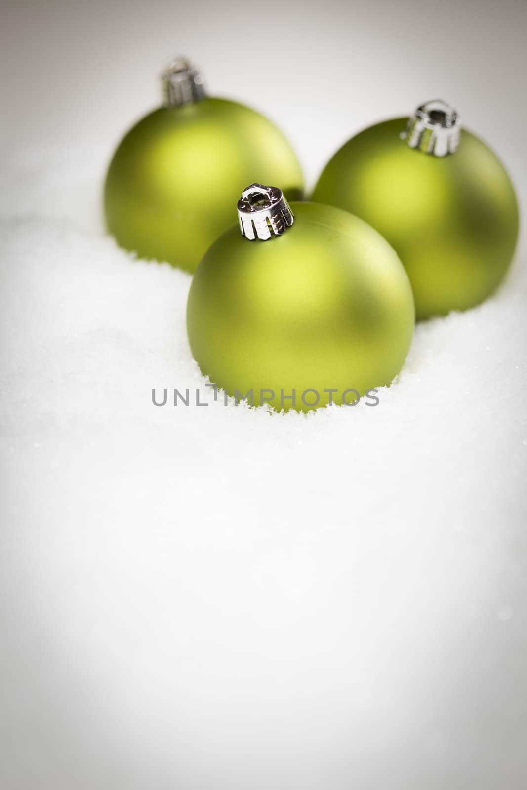 Beautiful Matt Green Christmas Ornaments on Snow Flakes Room For Your Own Text.