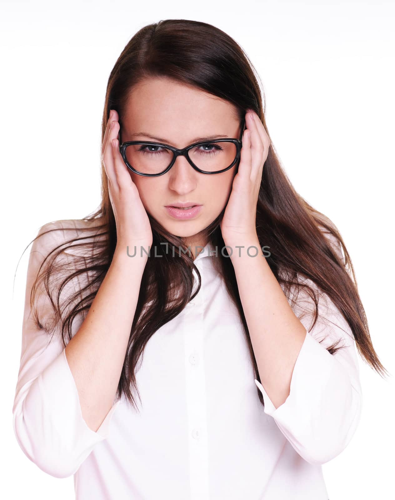 Portrait of a young businesswoman experiencing a headache. Isolated on white background