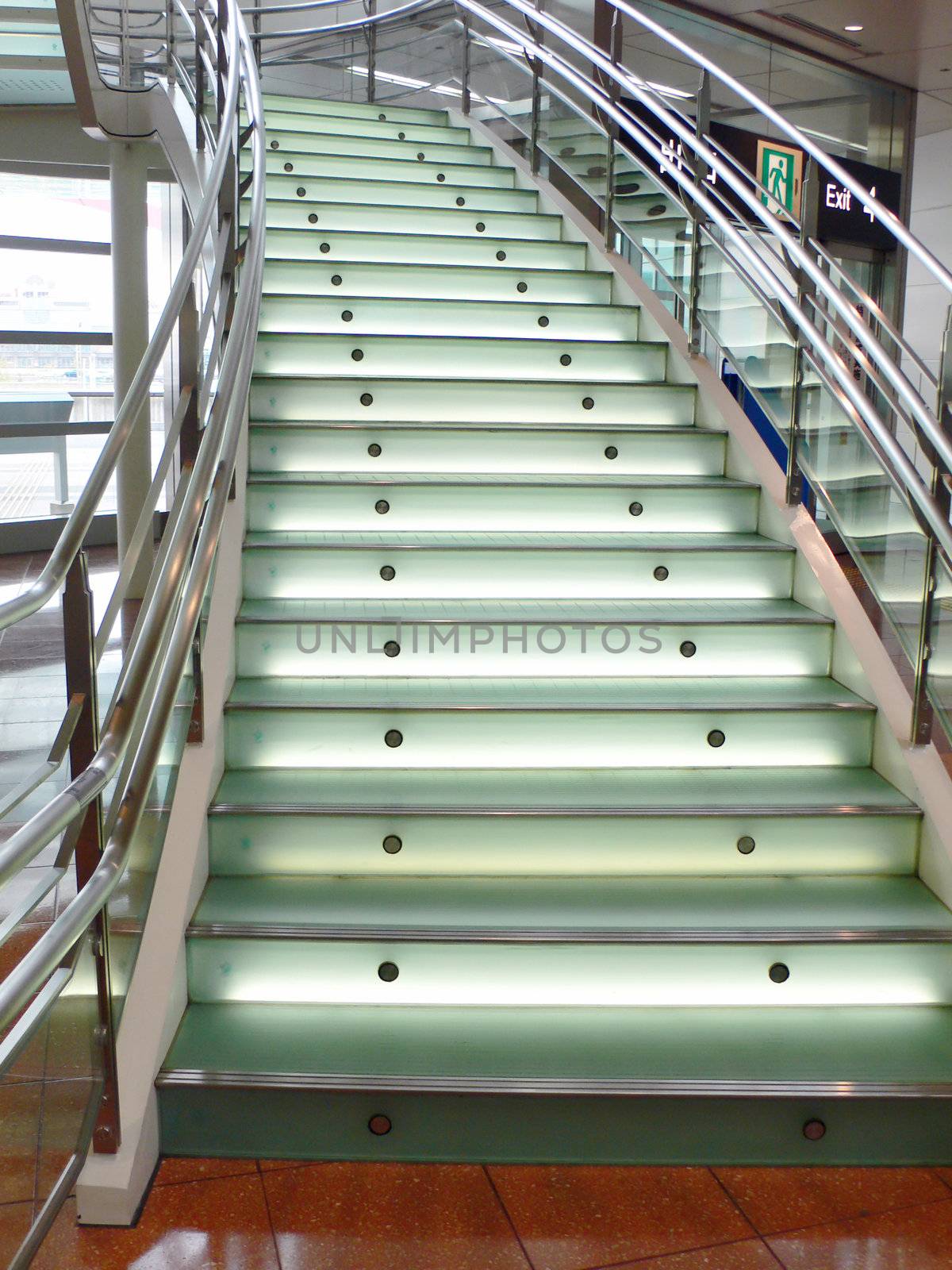 modern stained and matted glass stairs with metallic hand-rails