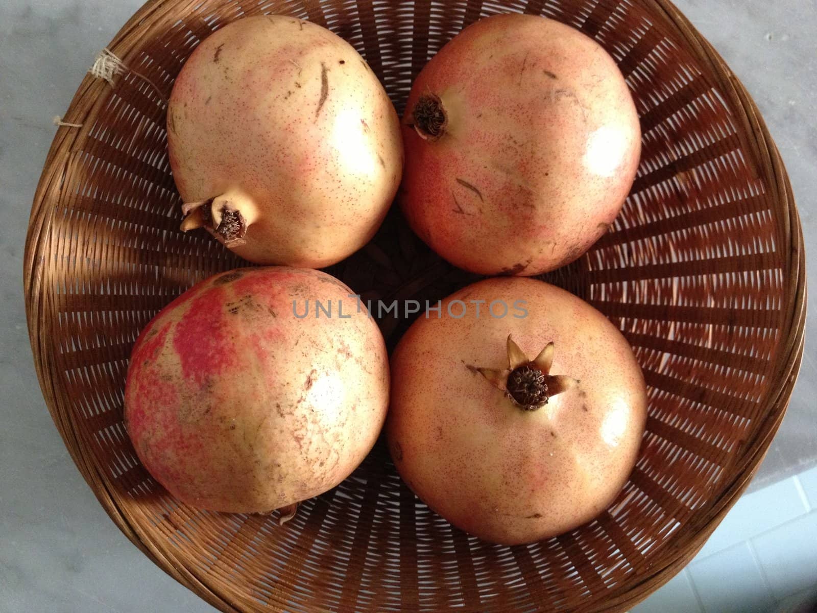 fruit of pomegranates in a basket