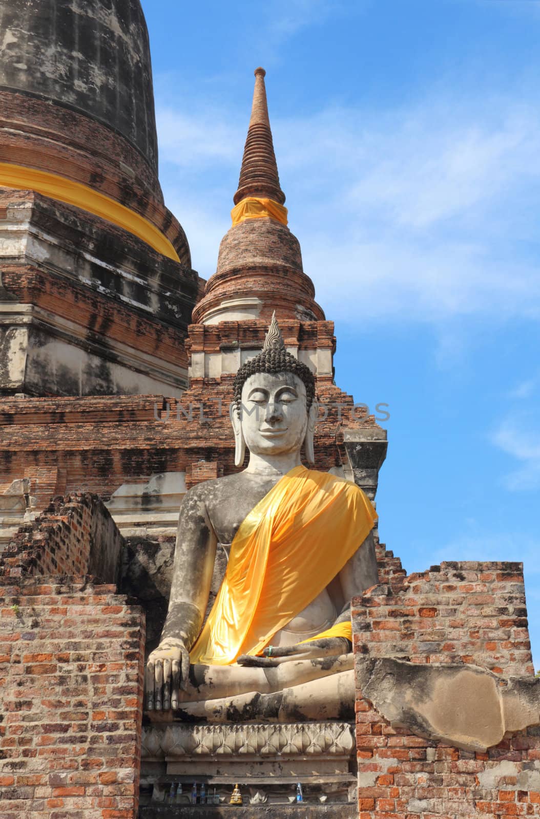 Ancient buddha statue with blue sky, Ayutthaya, Thailand.