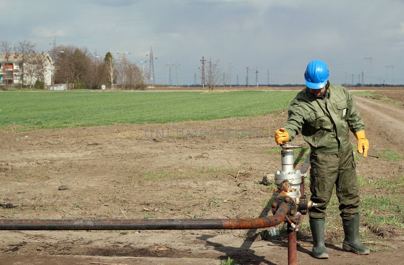 oil worker open pipeline valve