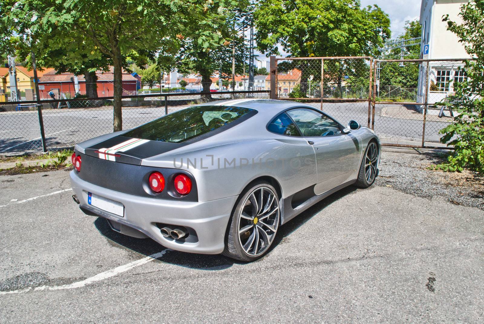 the ferrari 360 is a 2 seater sports car built by ferrari from 1999 to 2005, it succeeded the ferrari f355 and was replaced by the ferrari f430, it is a mid-engined, rear wheel drive v8-powered coupe, image is shot in July 2012 at halden station