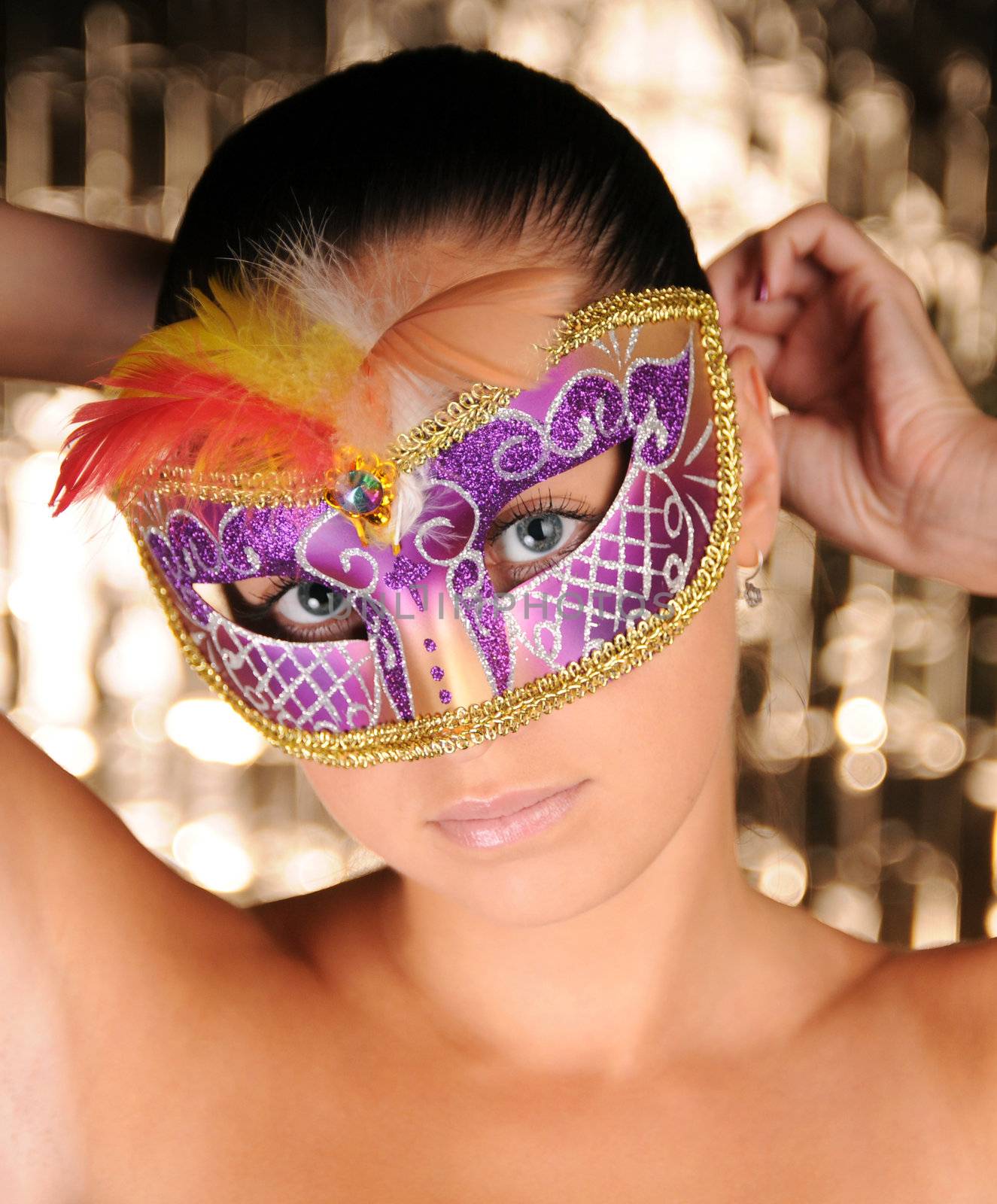 Beautiful young woman in carnival mask