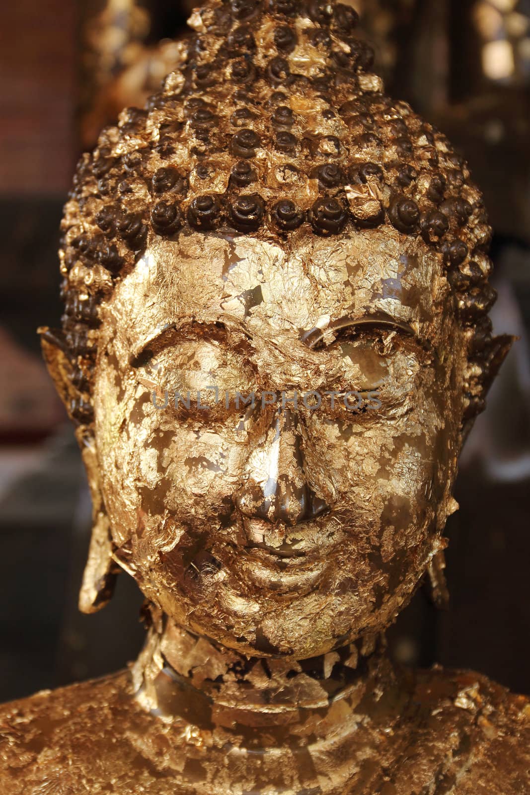 Close up buddha image covered with gold leaves at Wat Yai Chai Mongkhol, Ayutthaya, Thailand
