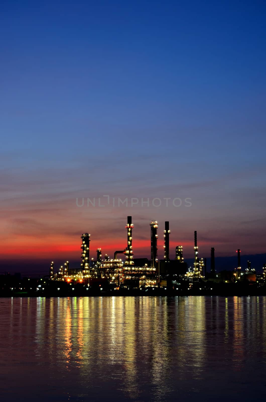 Sunrise scene of Oil refinery by pixbox77