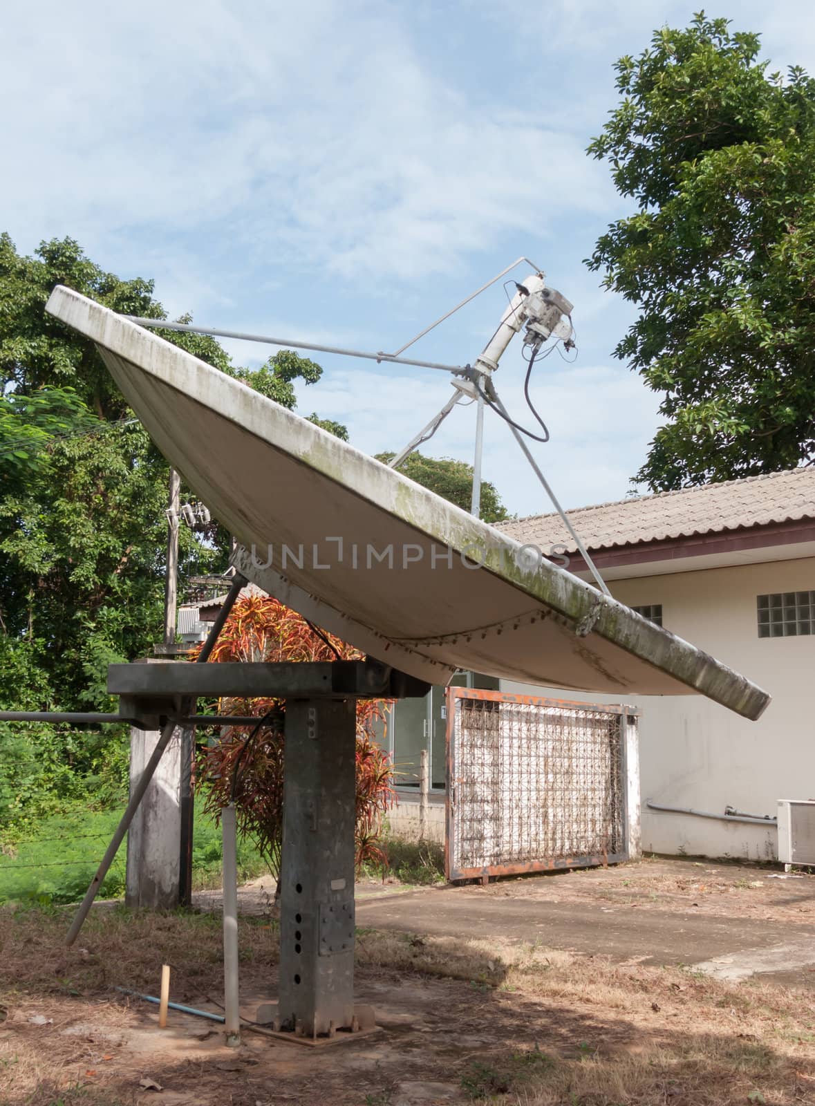 Large antenna dish on the ground at television and radio station