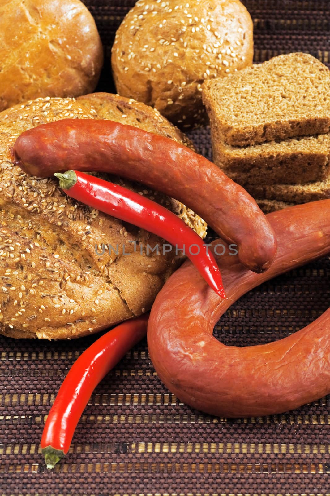 pepper sausage and bread as a food background by Serp
