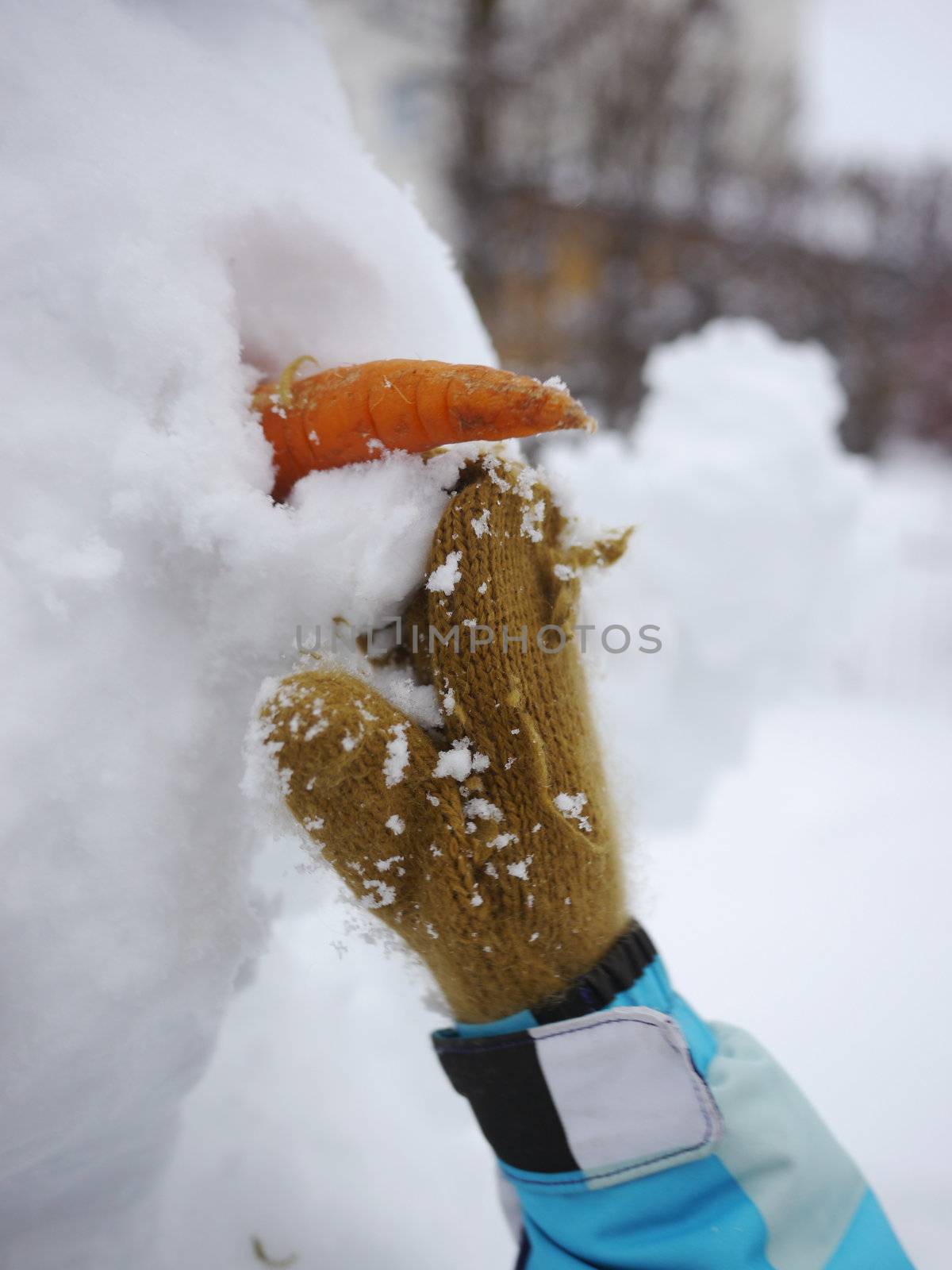 cute snowman on snowy outside at winter