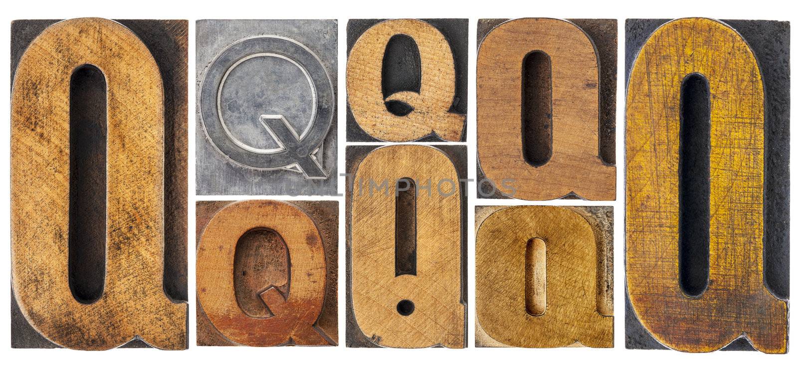 letter Q - 8 isolated vintage letterpress wood and metal type blocks with ink patina, variety of fonts