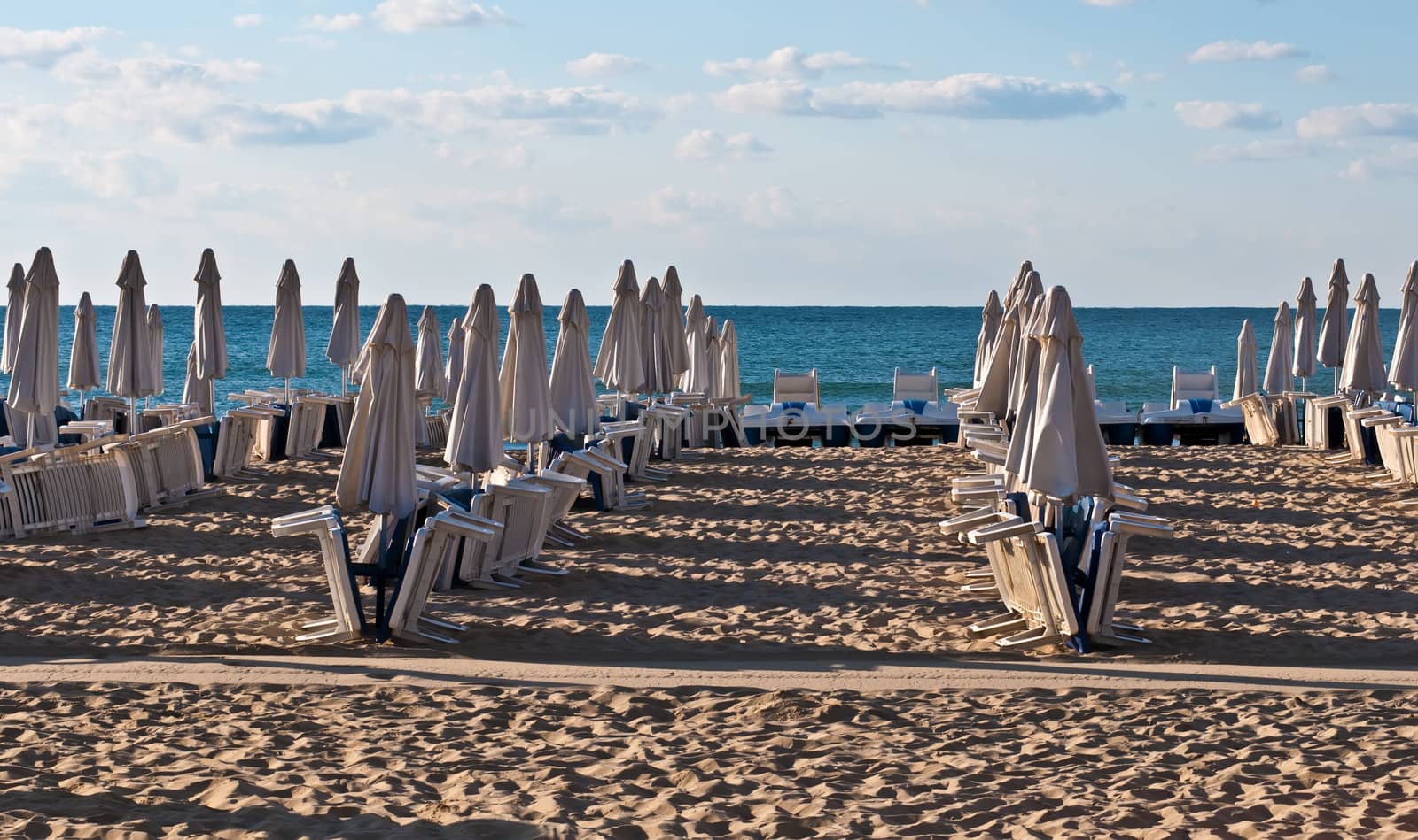 View of the beach with loungers and umbrellas.