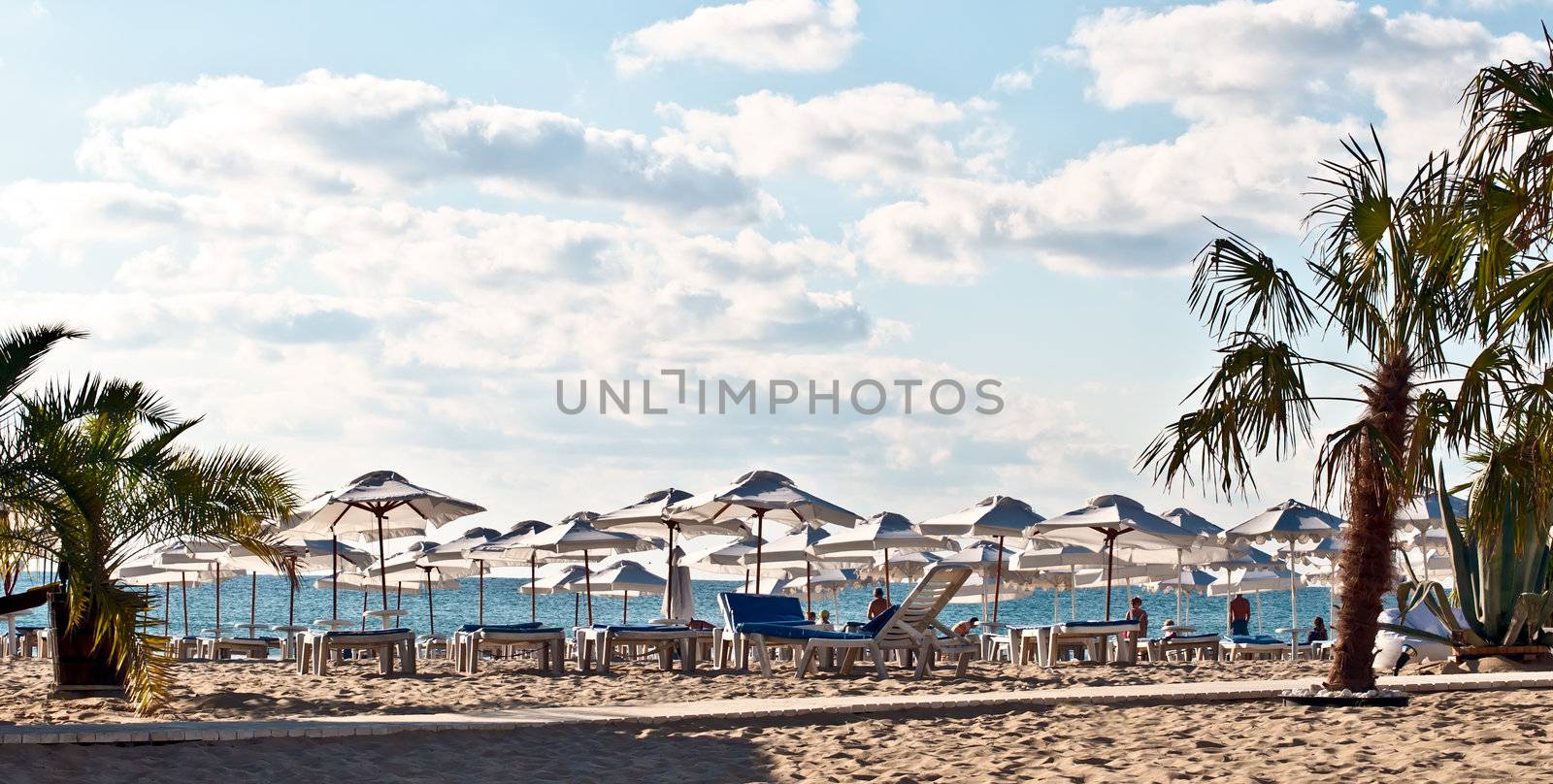 View of the beach with loungers and umbrellas.