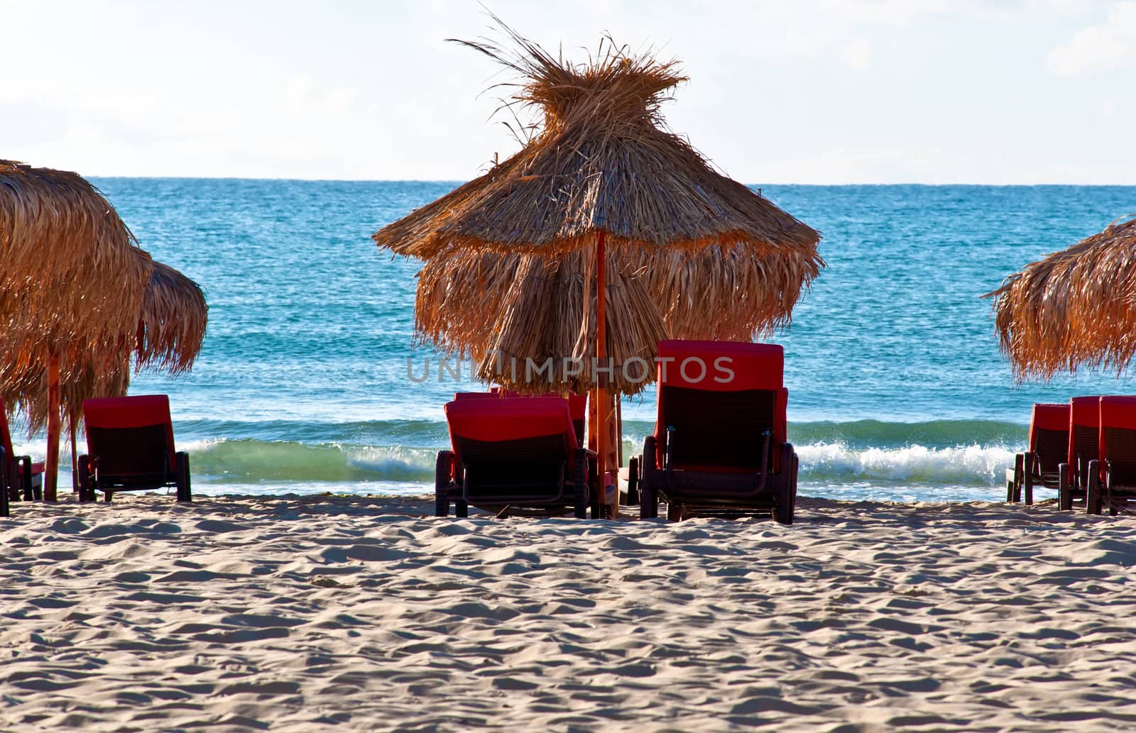 View of the beach with loungers and umbrellas.
