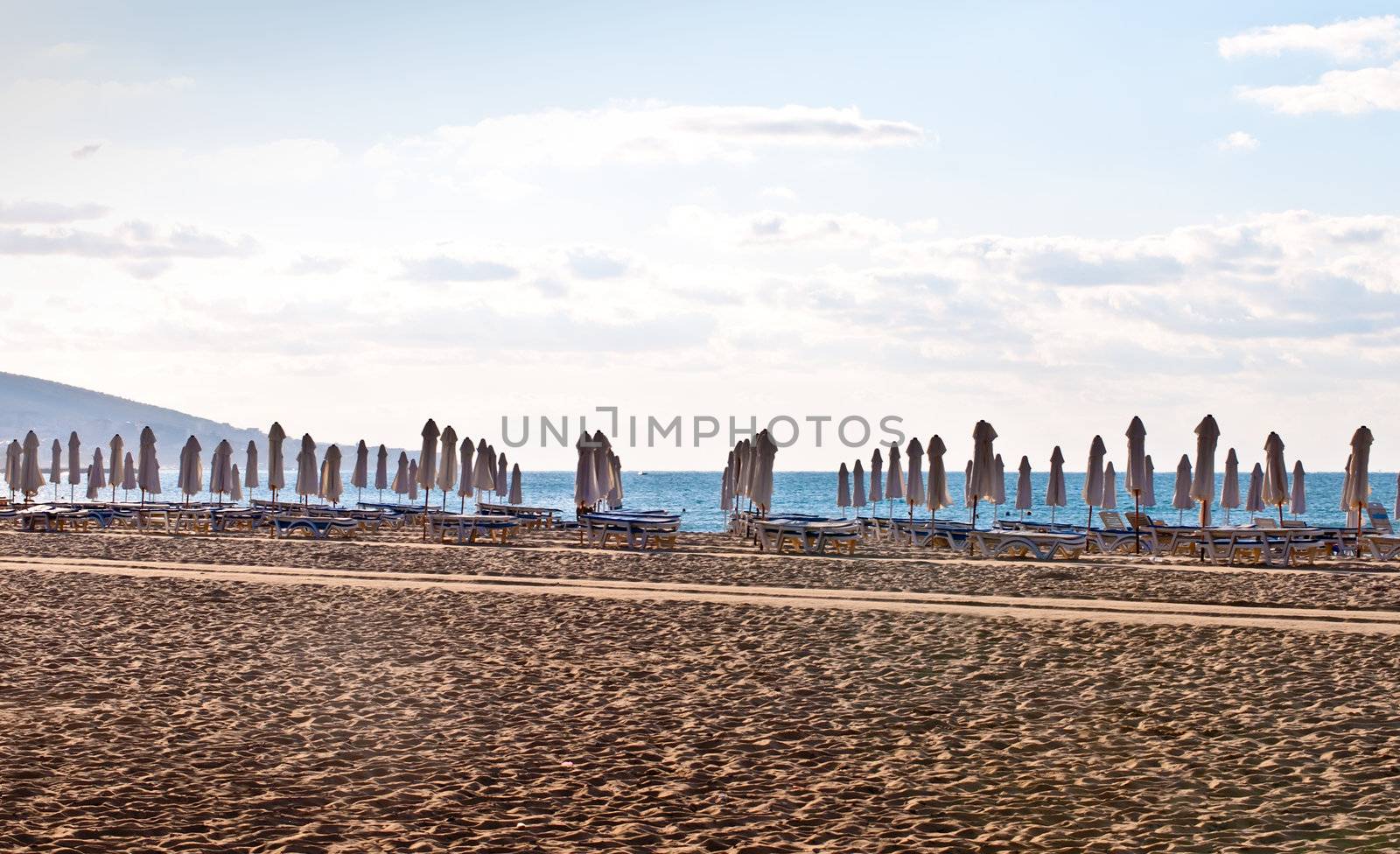 View of the beach with loungers and umbrellas.