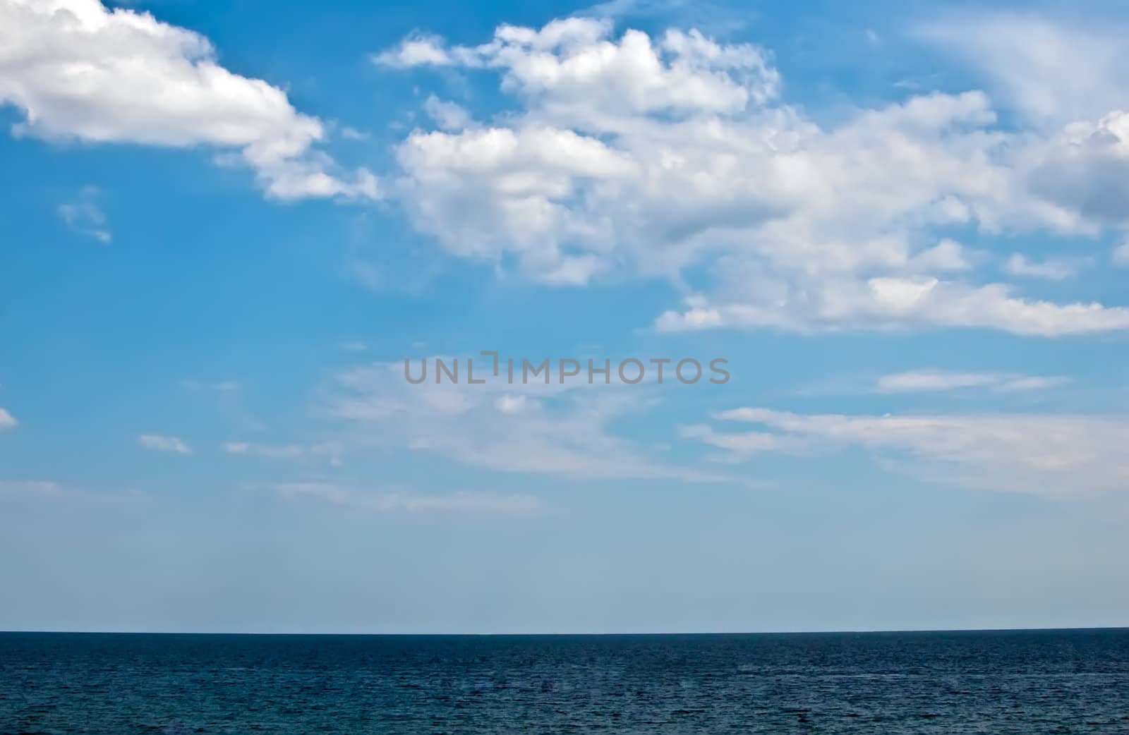 Clear blue sea  and sky with clouds . by LarisaP