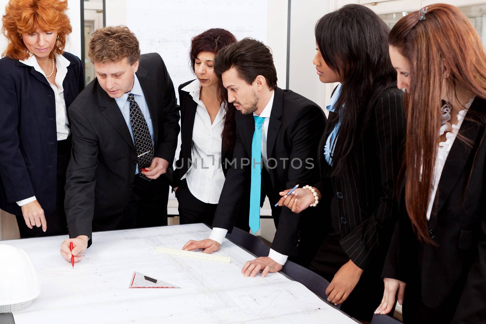 business team looking architecture project in office