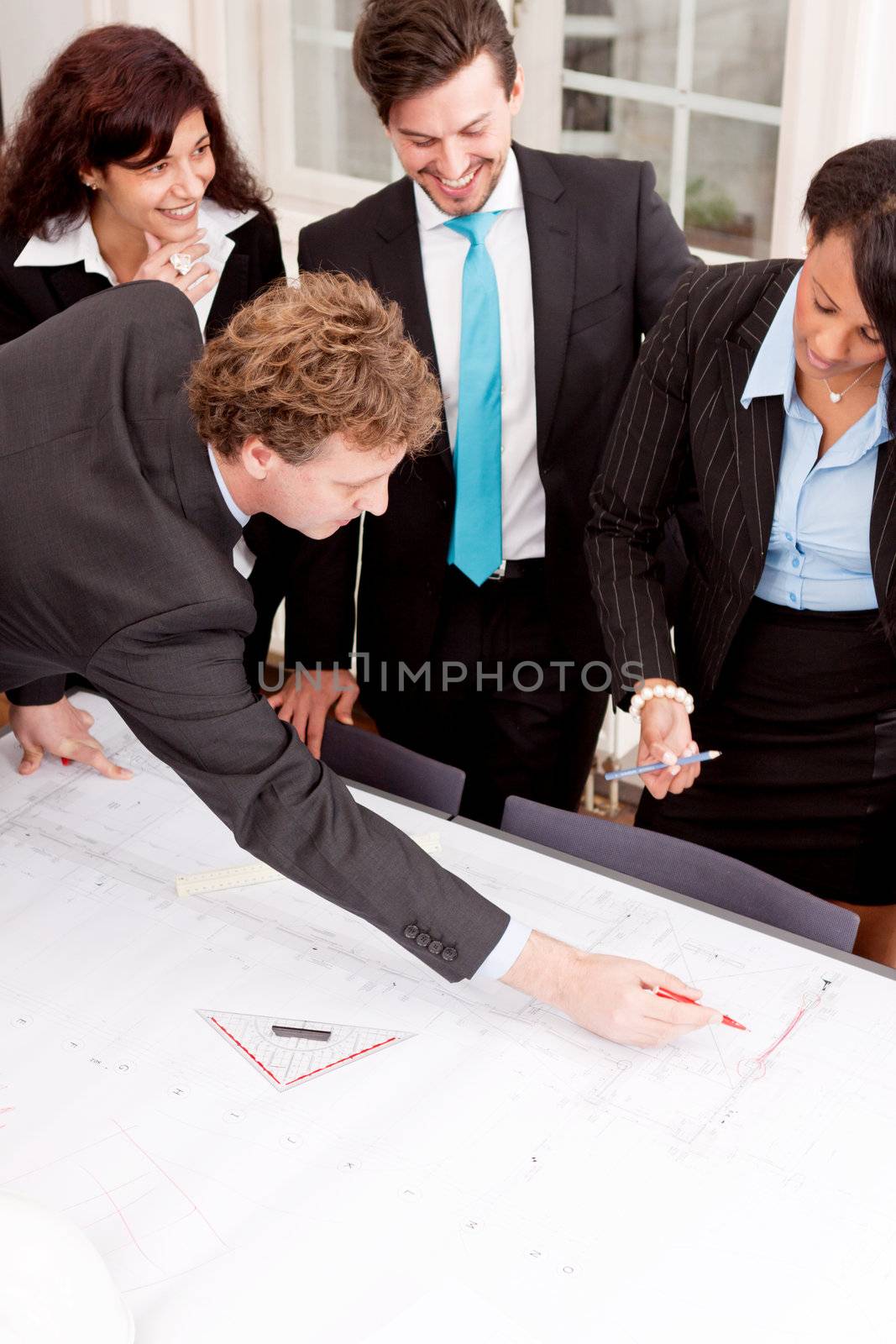 business team looking architecture project in office