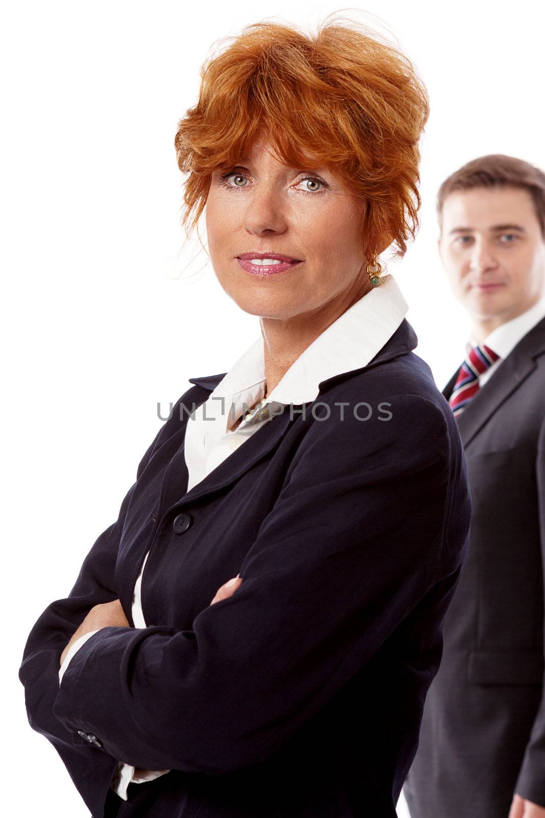 red head woman in business outfit  front man in black suit background