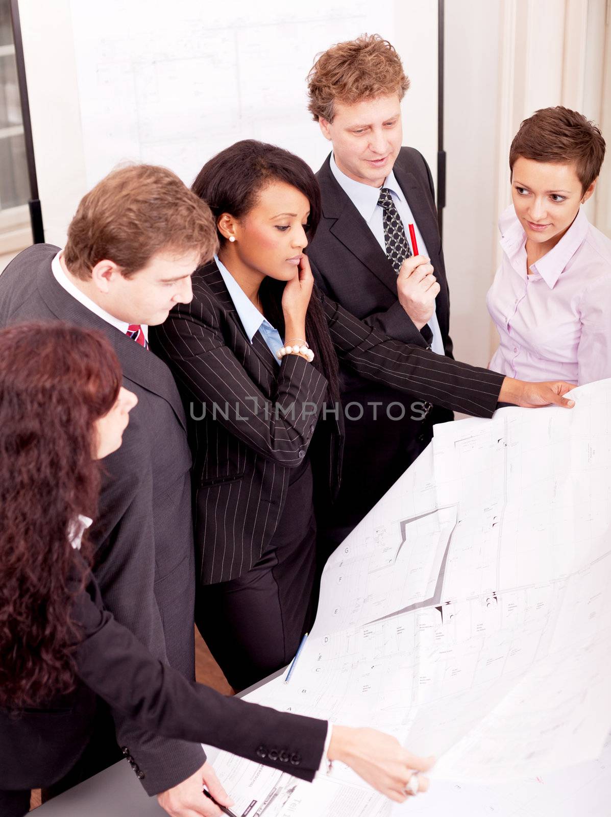 business team looking architecture project in office