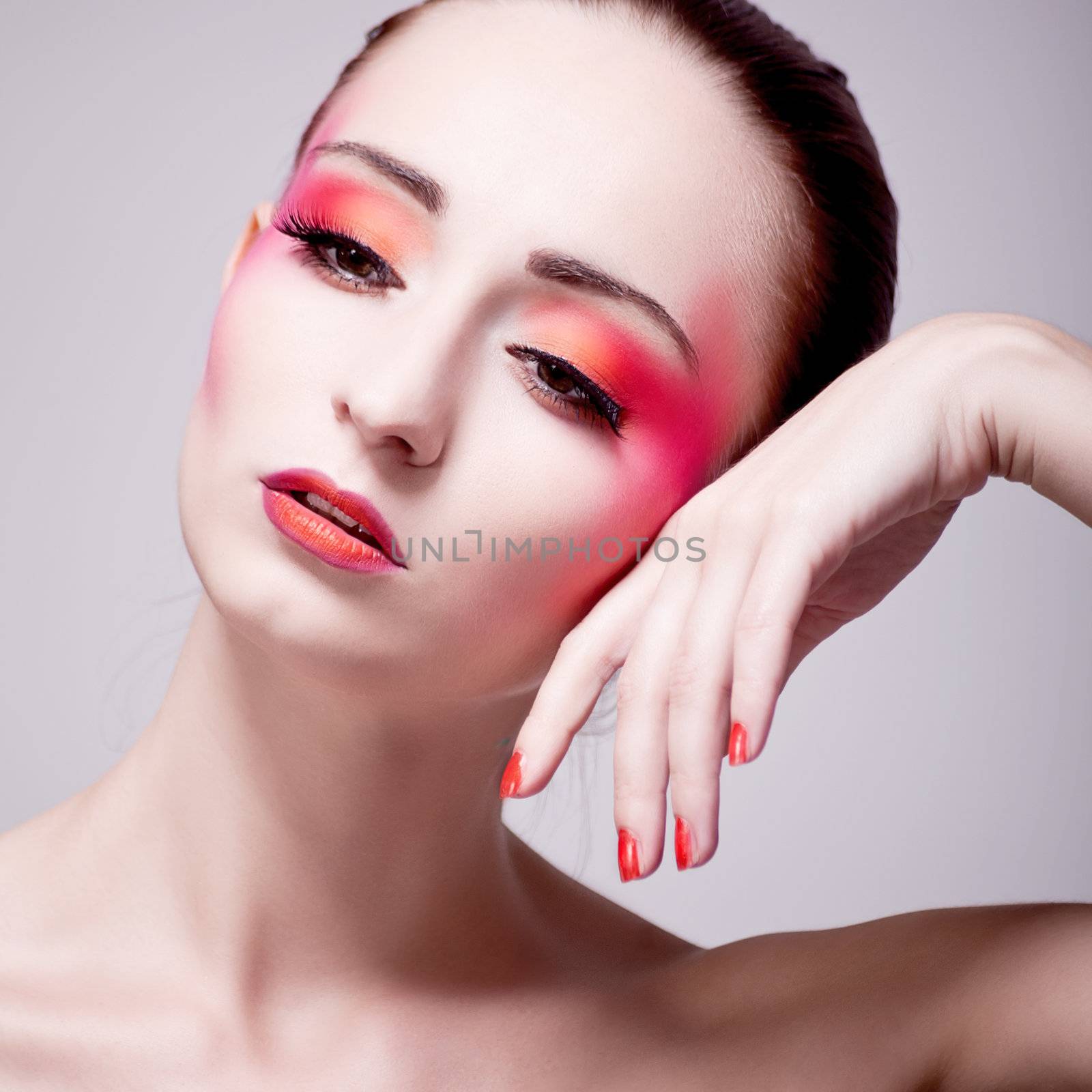 woman portrait with extreme make up in orange and pink by juniart
