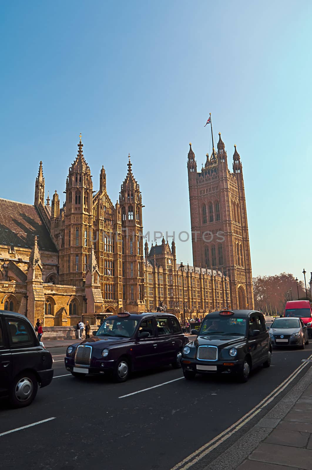 Westminster - Houses of Parliament in London and london's iconic black cabs are a symbol of the city.