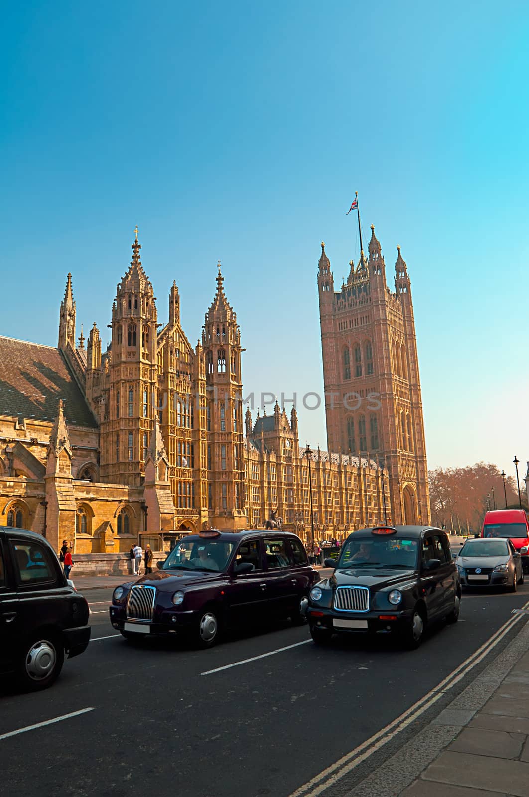 Westminster - Houses of Parliament in London and london's iconic black cabs are a symbol of the city.
