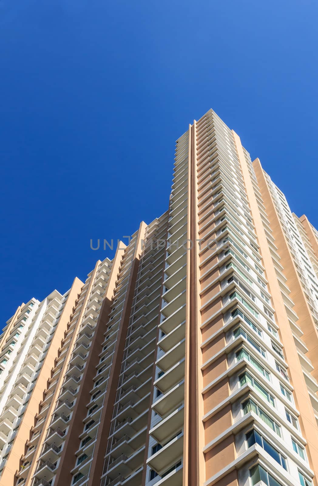 New Highrise Condominium with Blue Sky Background by punpleng