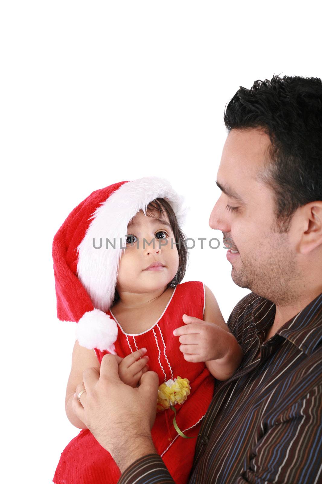 Father and daughter looking happy wearing santa Christmas hat. by dacasdo