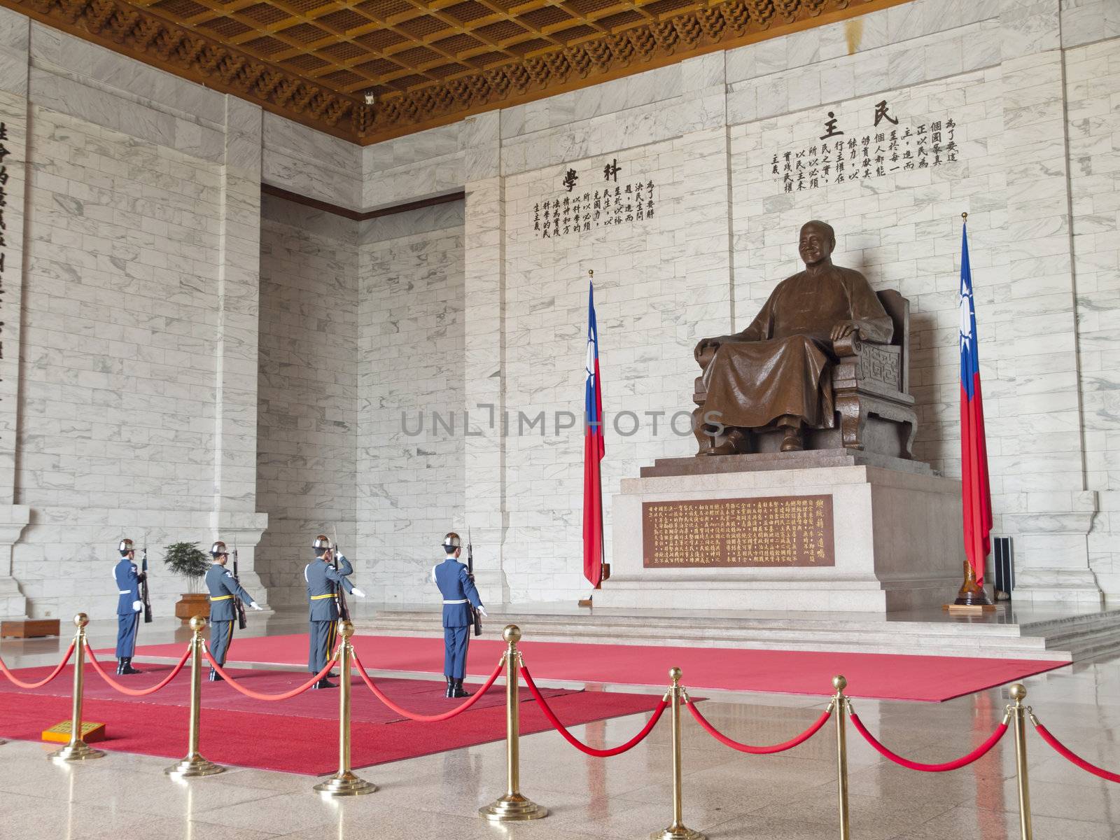 TAIPEI, TAIWAN - APRIL 29: A large bronze statue of Chiang Kai-shek on April 29, 2010 in Taipei, Taiwan. This huge bronze statue is shown smiling, seated and wearing traditional Chinese dress of Chiang Kai-shek dominates the main hall in the CKS memorial hall.