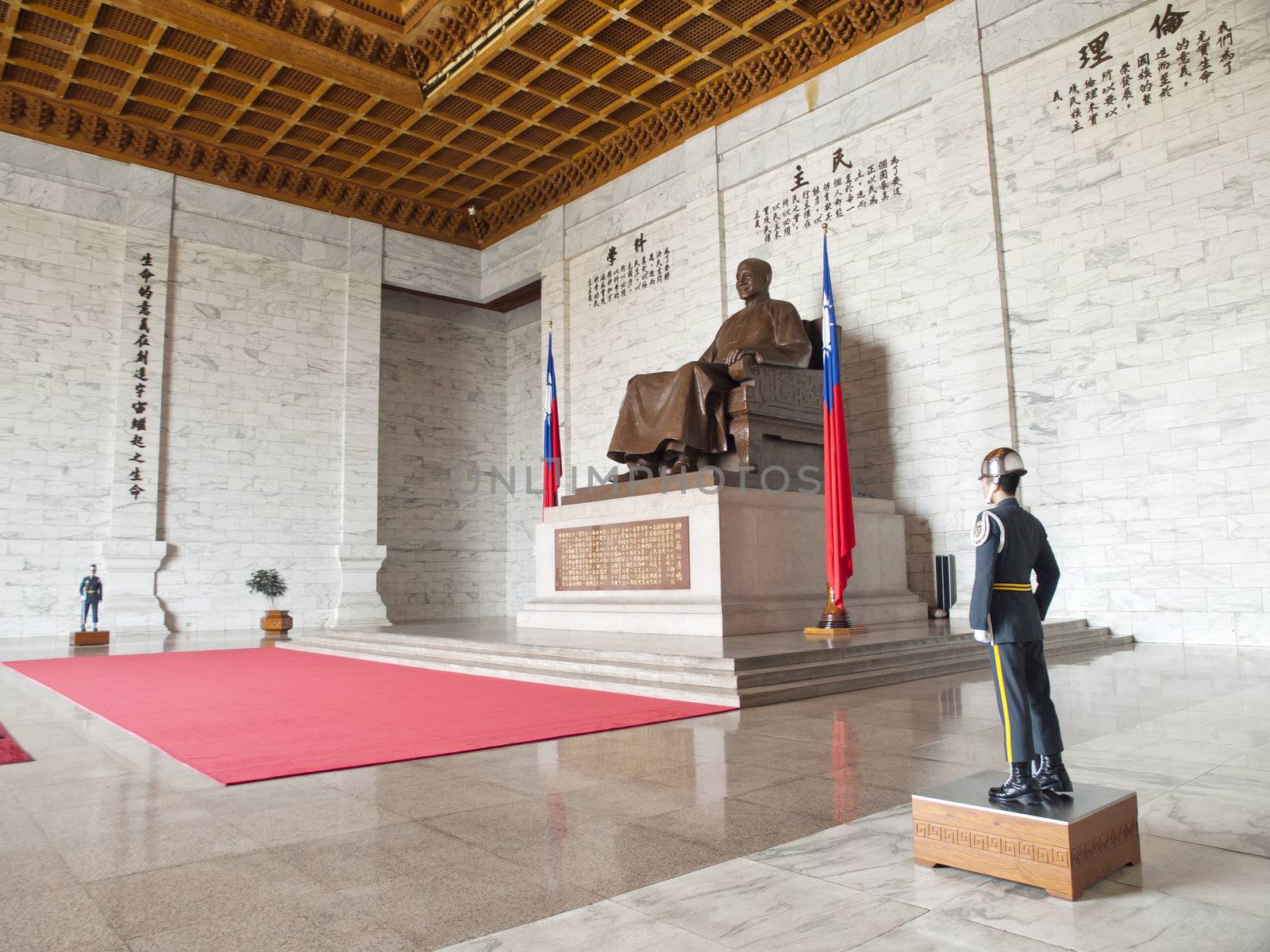TAIPEI, TAIWAN - APRIL 29: A large bronze statue of Chiang Kai-shek on April 29, 2010 in Taipei, Taiwan. This huge bronze statue is shown smiling, seated and wearing traditional Chinese dress of Chiang Kai-shek dominates the main hall of the CKS memorial hall.