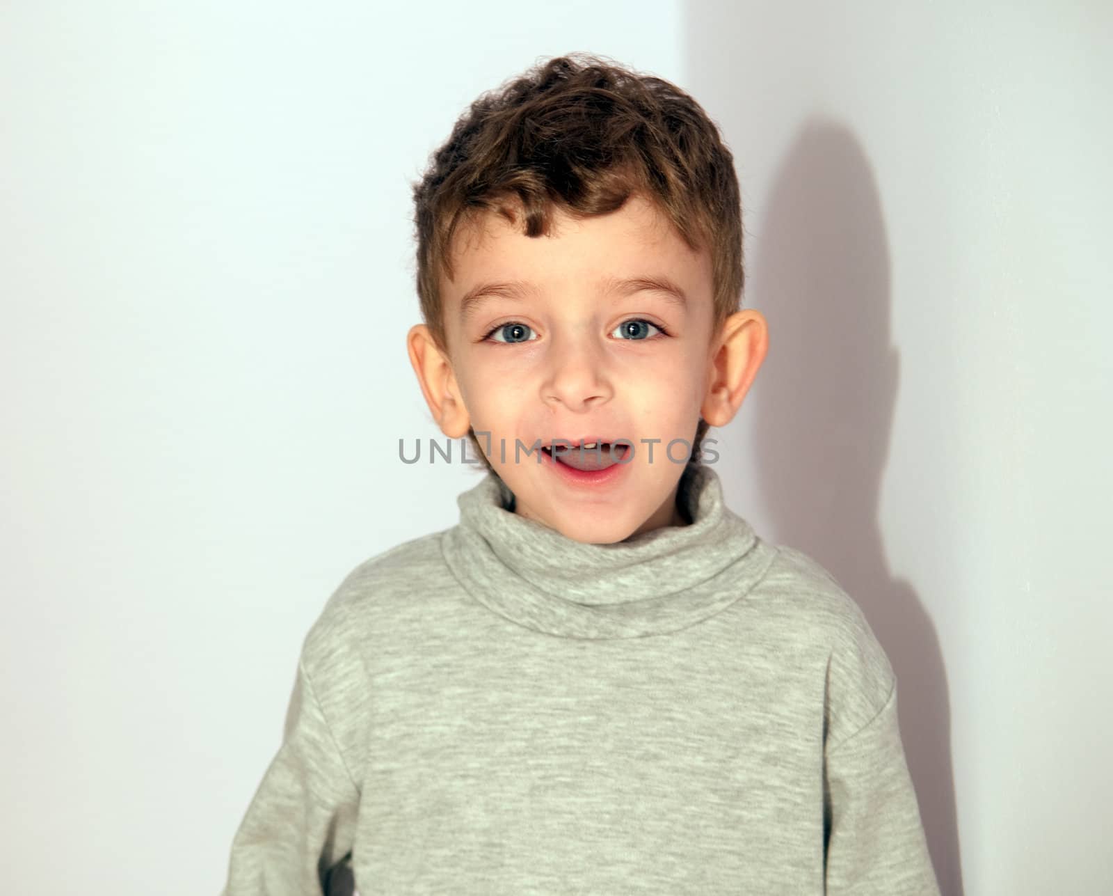 Portrait of happy  little boy looking at camera .