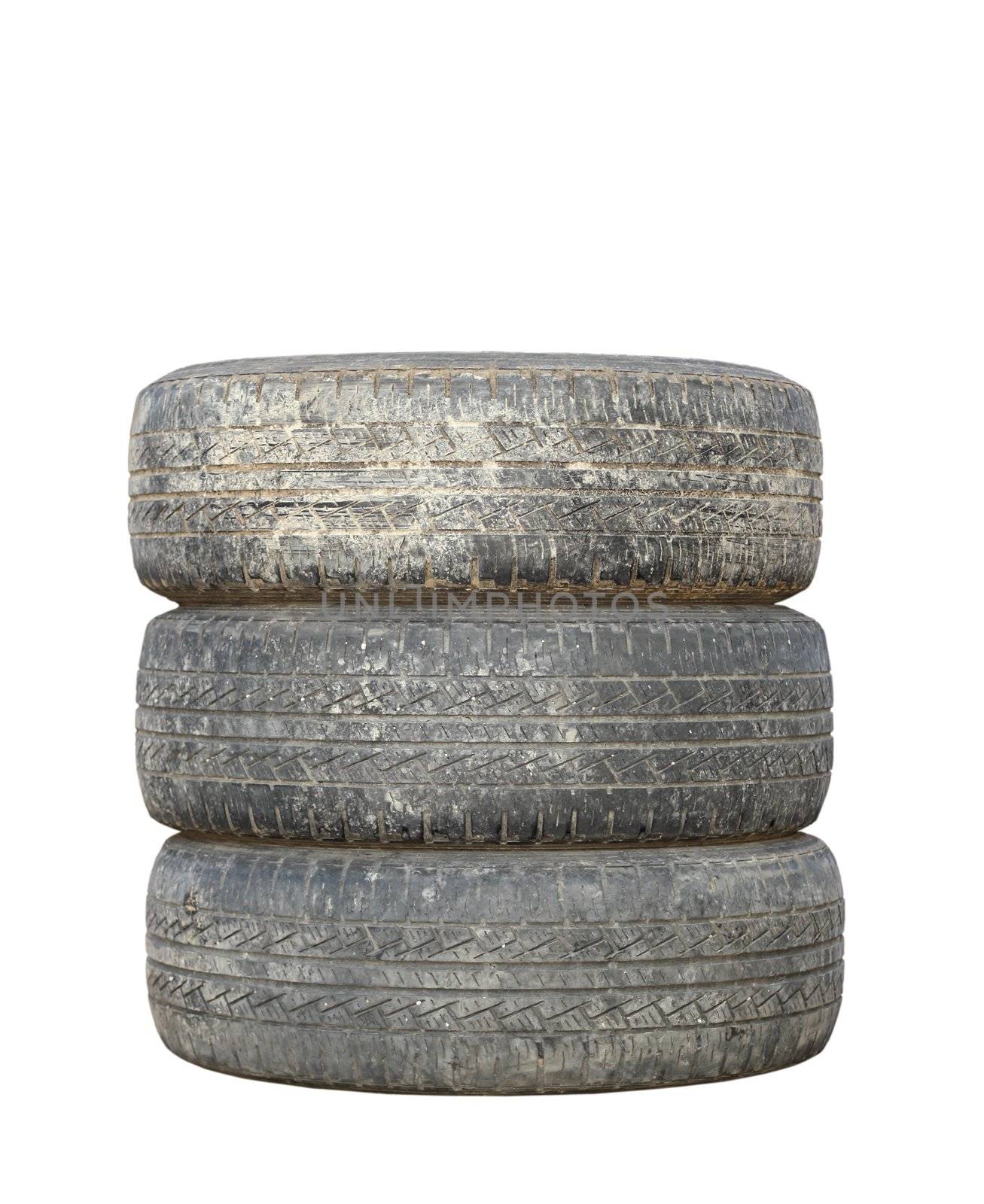 three dirty used tires isolated over white background
