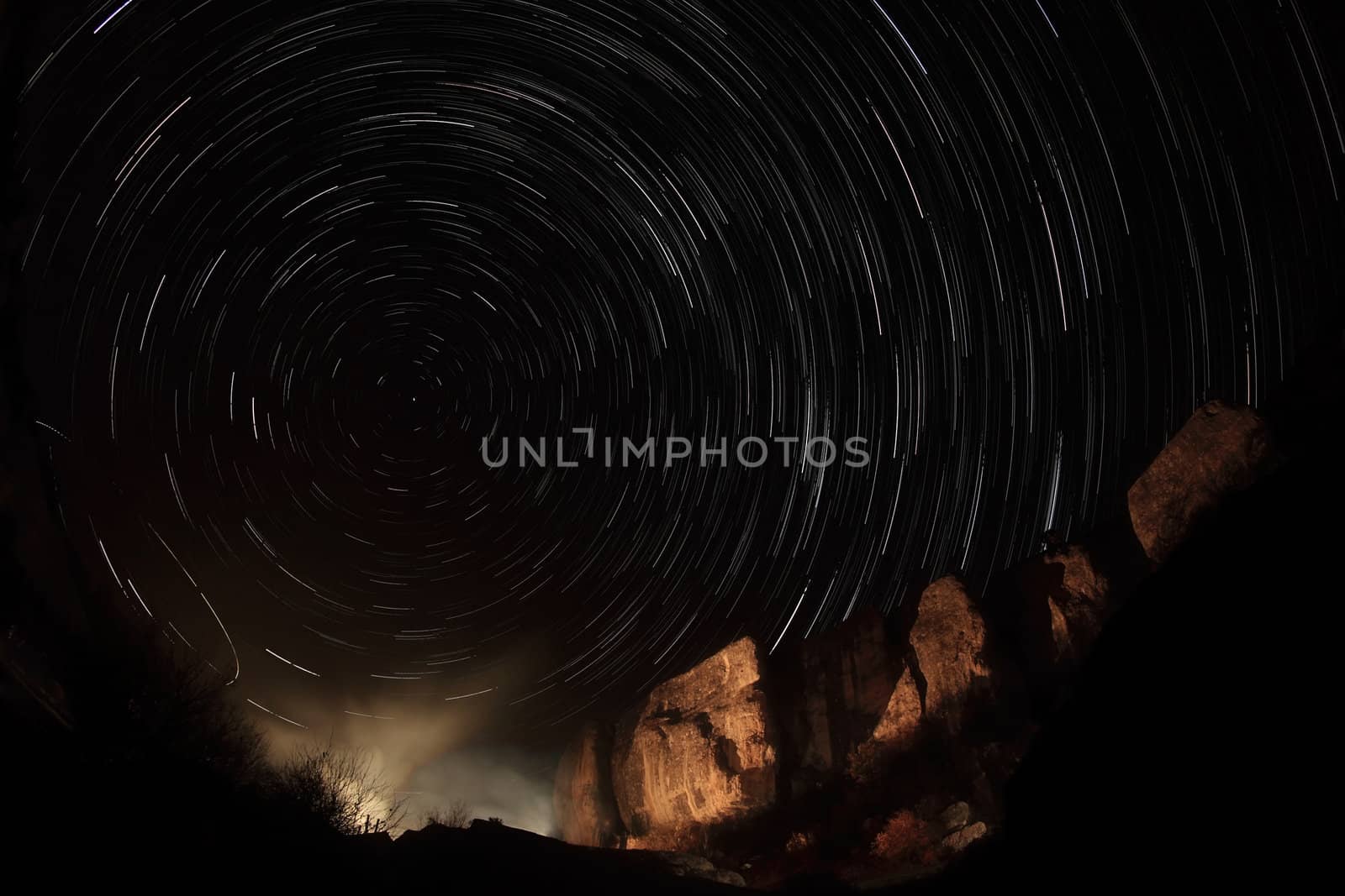 stars passing by behind mountain. Cave city Eski-Kermen, Crimea, Ukraine
