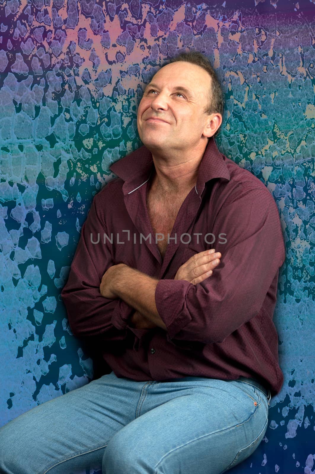 Handsome man over dreamy violet background .