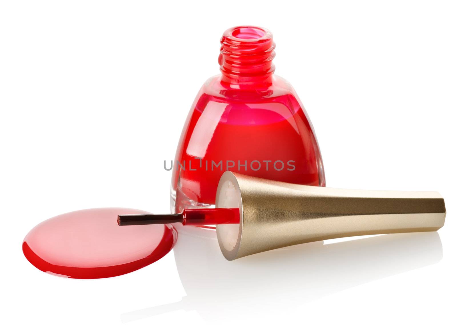 Red nail polish and brush isolated on a white background