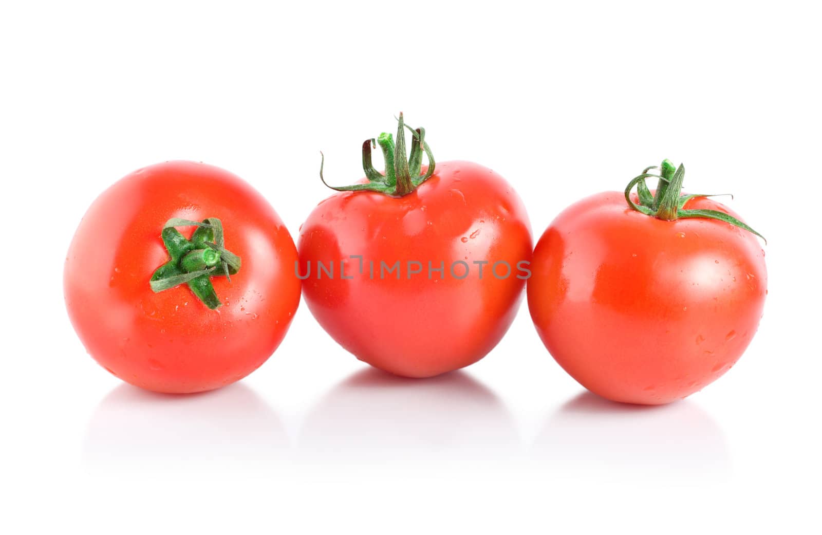 Three mellow red tomatoes by Givaga
