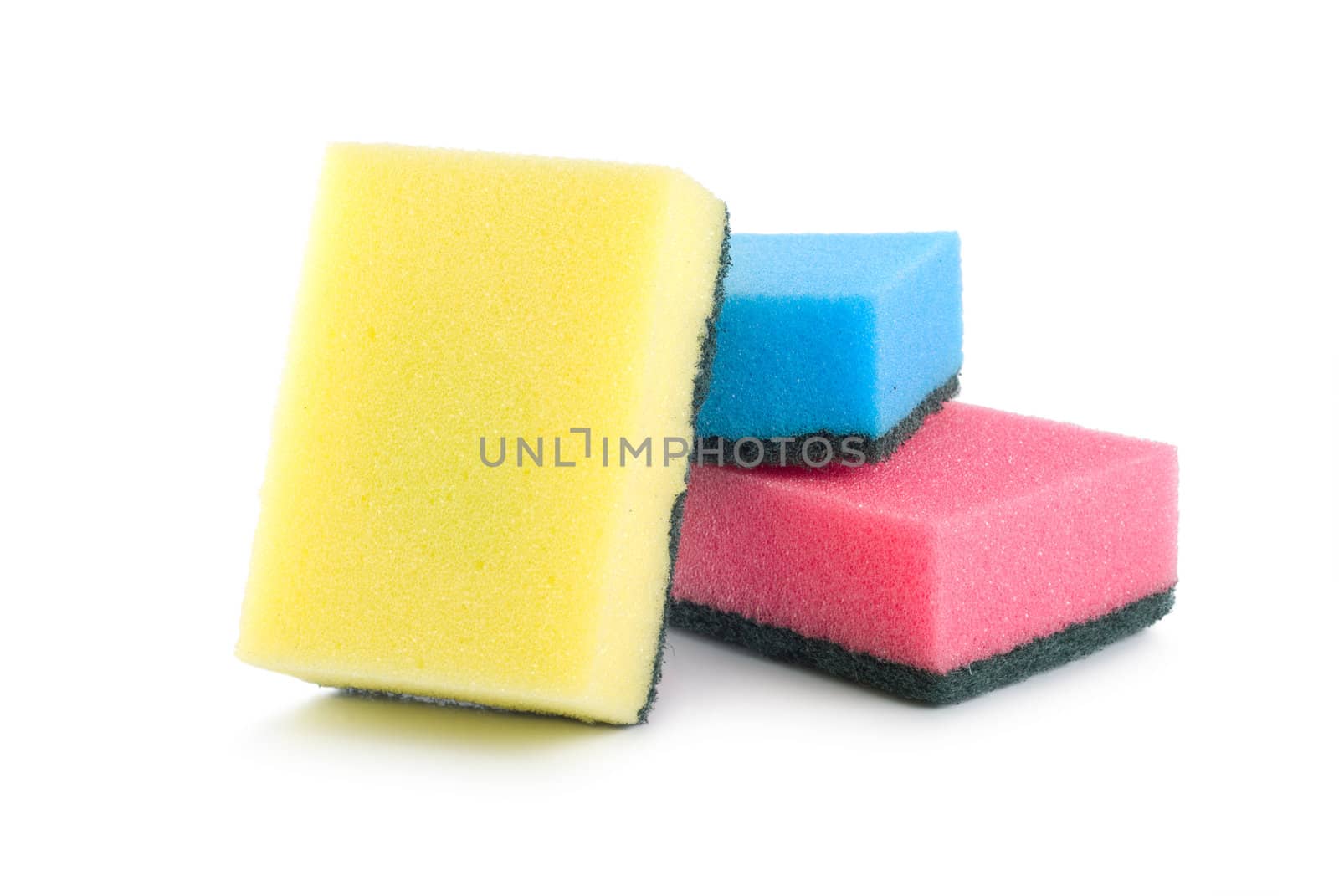 Three colored sponges isolated on white background