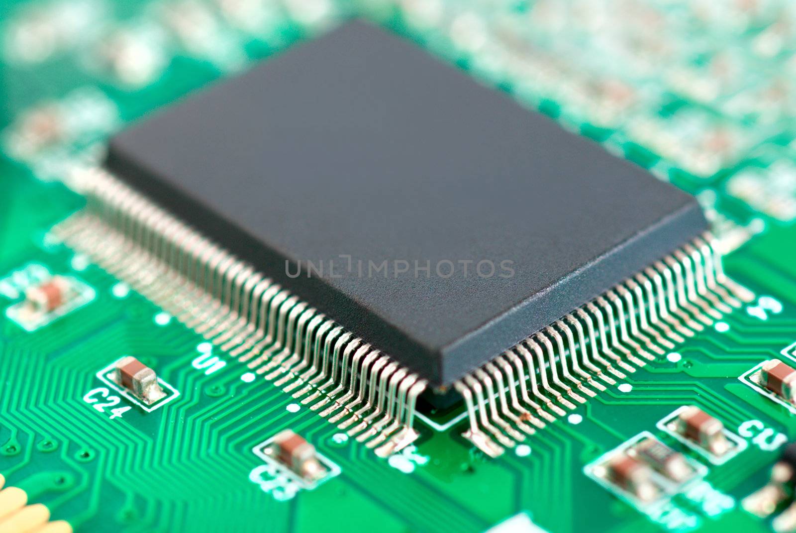 Bright green background with motherboard's electronic circuit