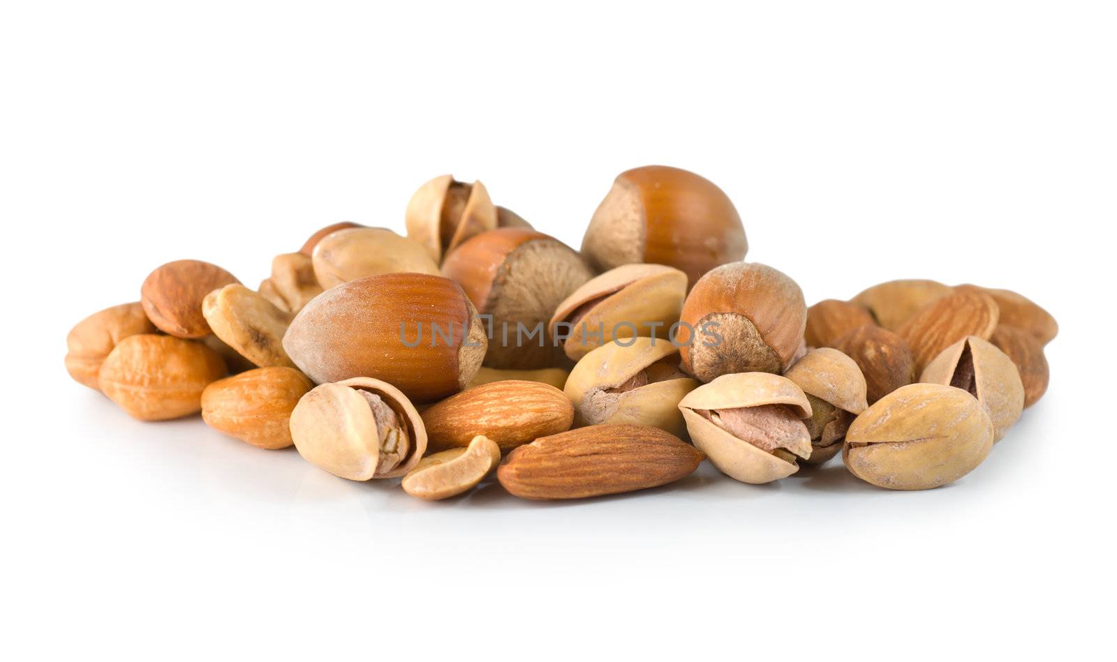 Cashews, hazelnuts, pistachios isolated on white background