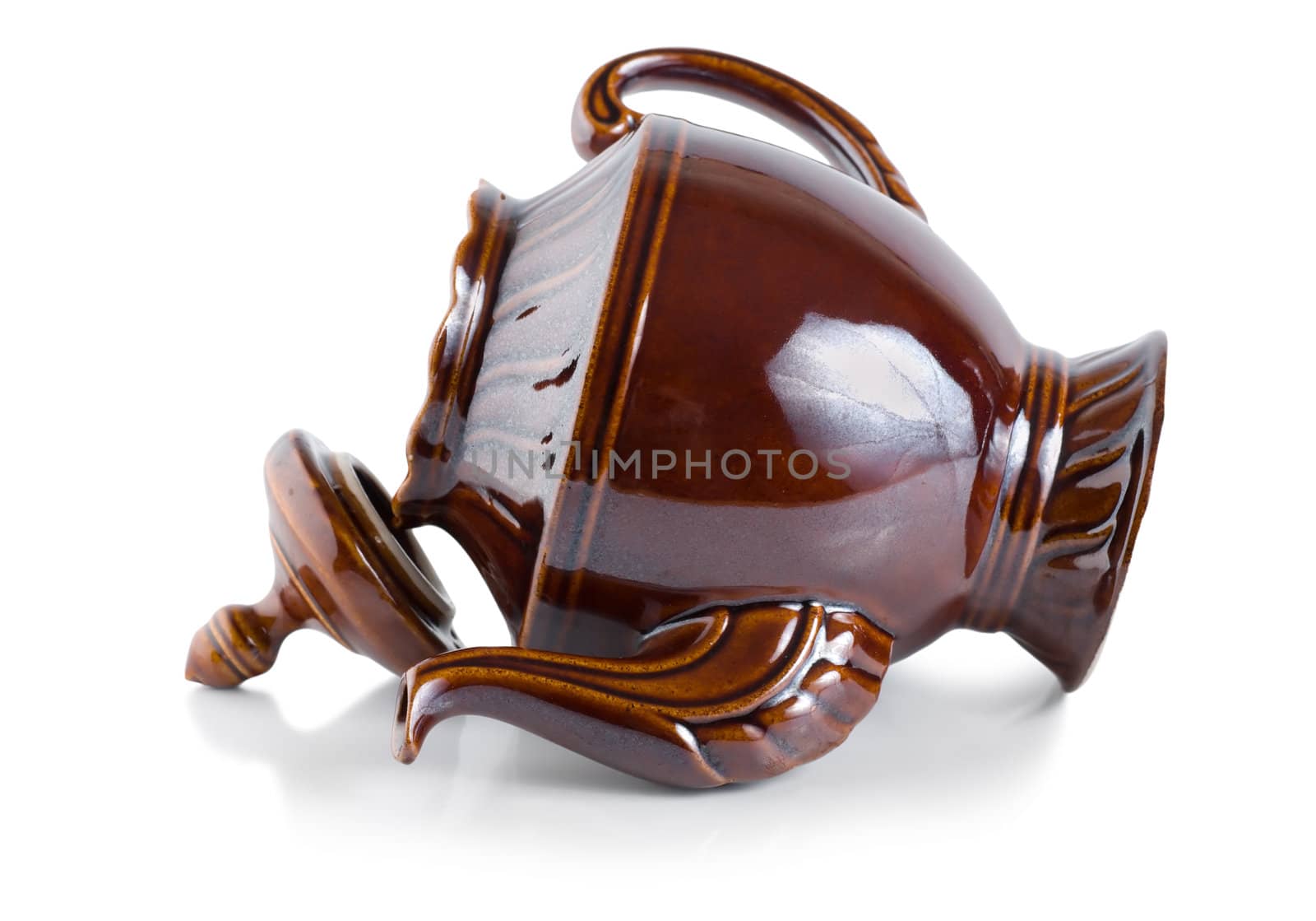 Brown ceramic teapot isolated on a white background