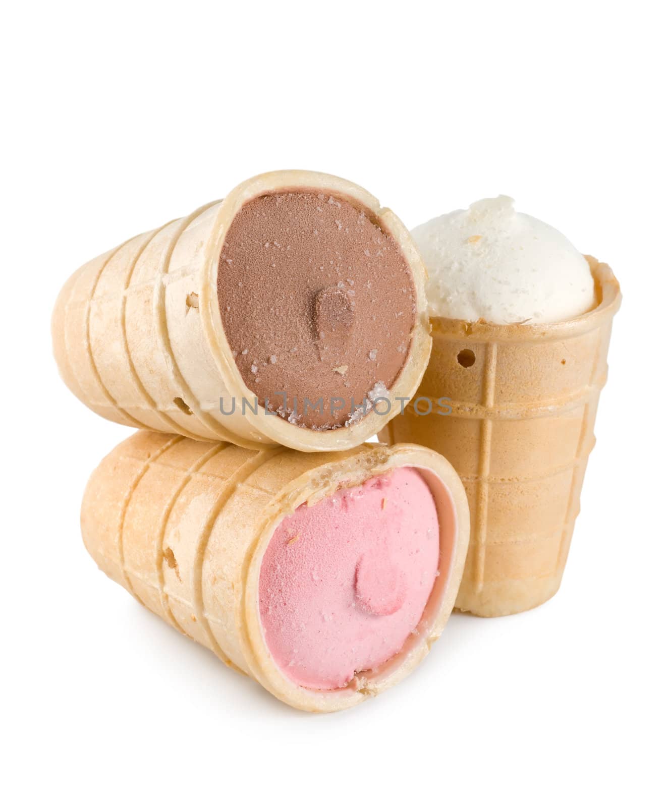 Three different flavors of ice cream cones... chocolate, vanilla, and strawberry 