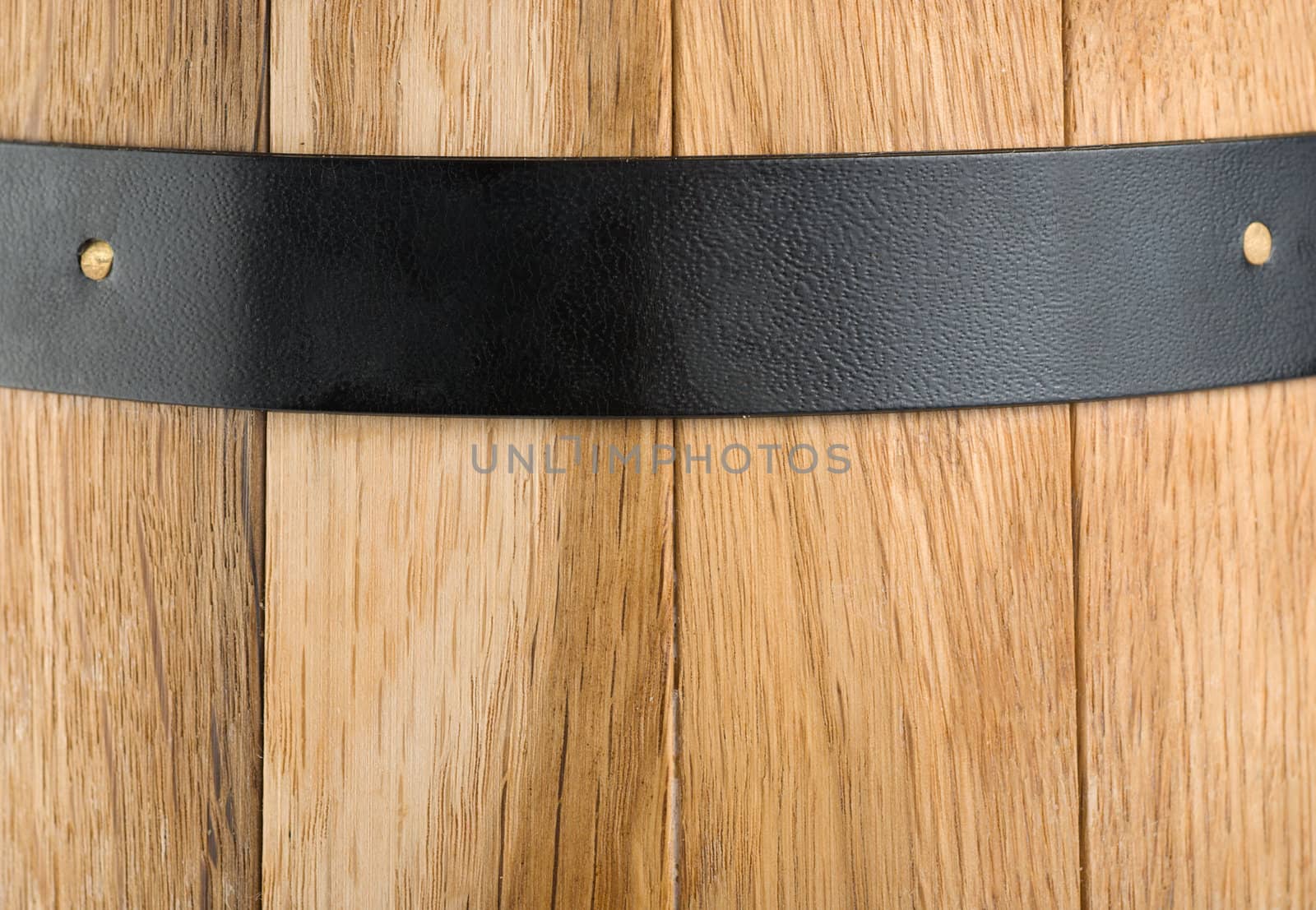 Background of a wooden barrel and a metal strip
