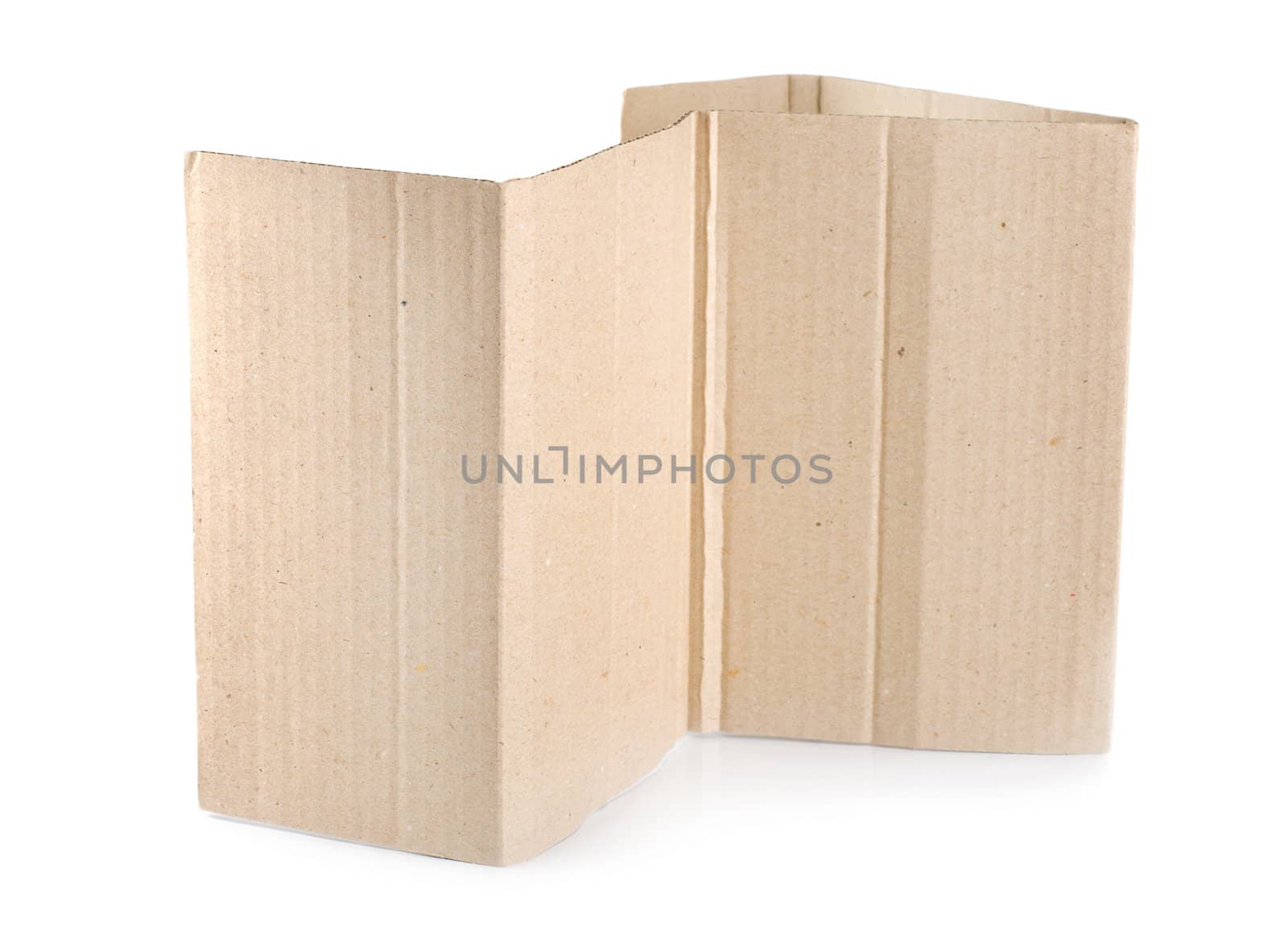 Torn blank cardboard, casting natural shadow on white. Ready for your message.