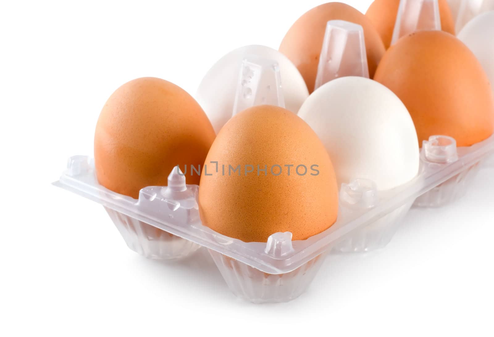 Tray of eggs isolated on white background